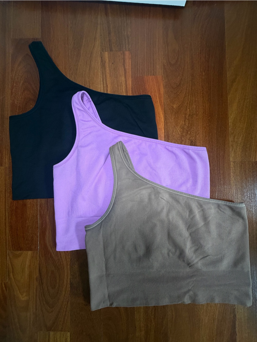 Athleta One-Shoulder Tank Tops in Black, Purple, and Brown